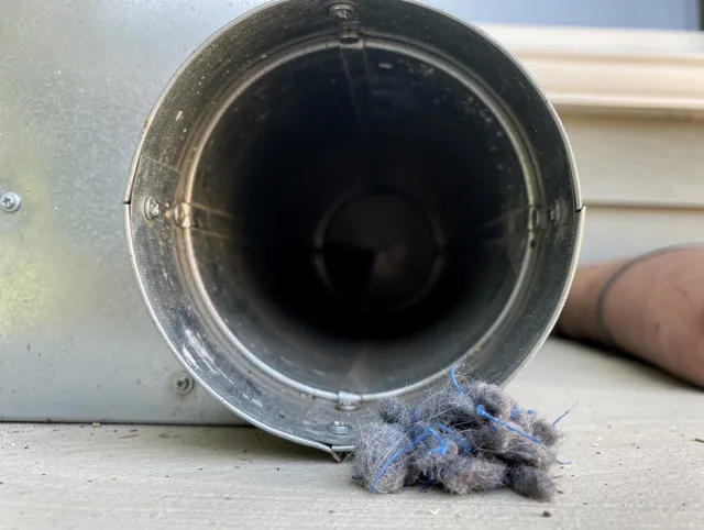 Florence-Graham Dryer Vent Cleaning technician using specialized equipment to clear severe dryer vent blockage in Florence-Graham